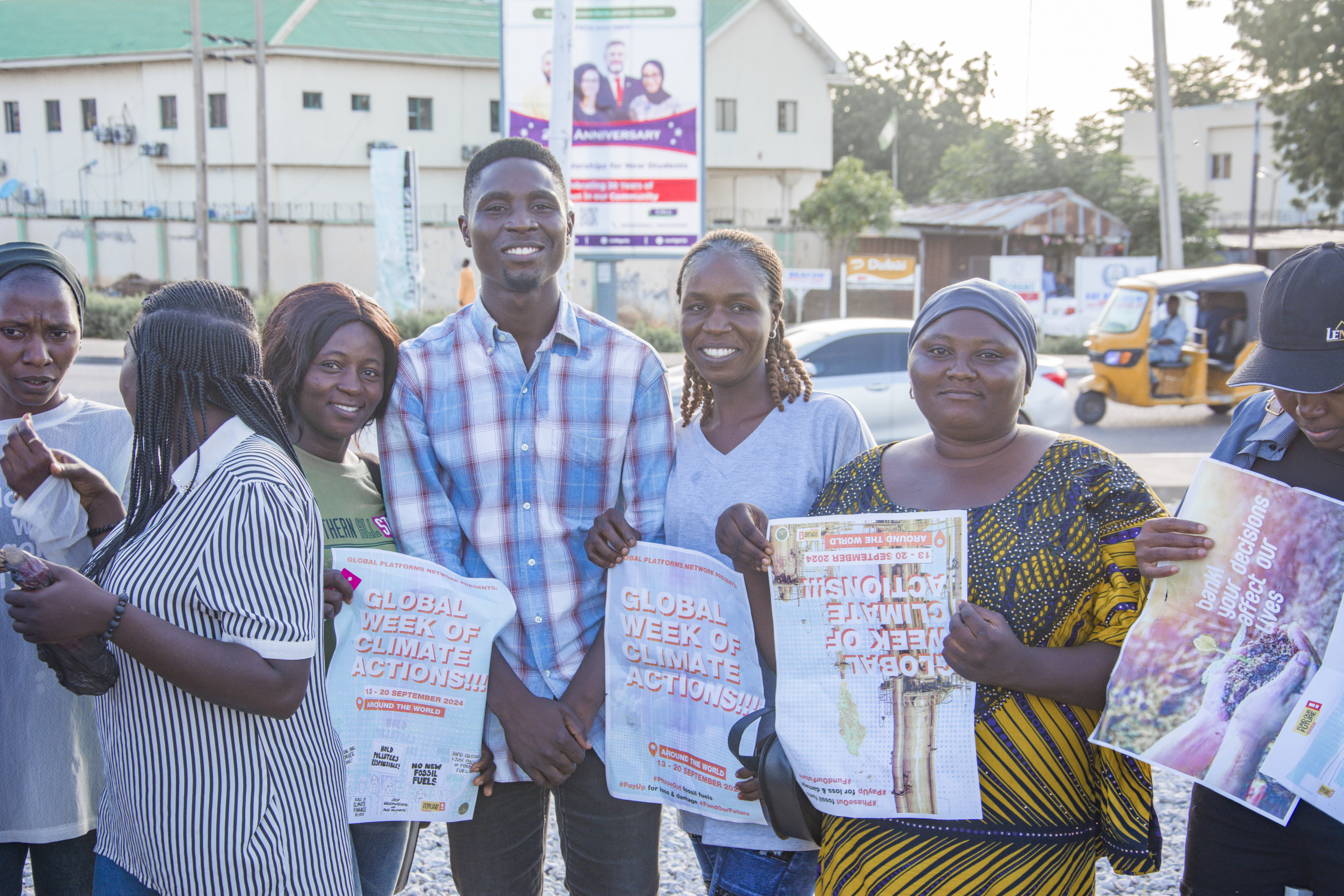 Youth march with activist banner, Yola